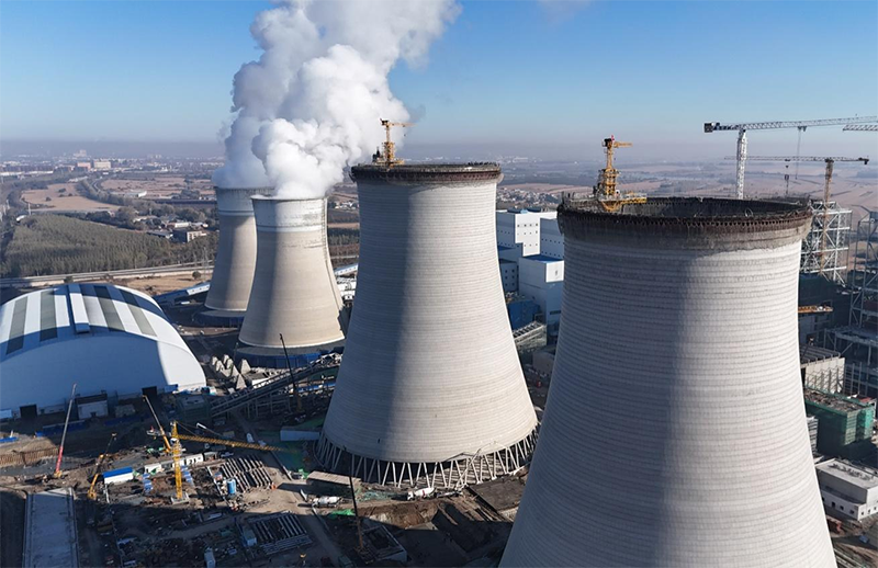 筑顶冰城暖源!国能哈热二期项目3号排烟冷却塔顺利封顶